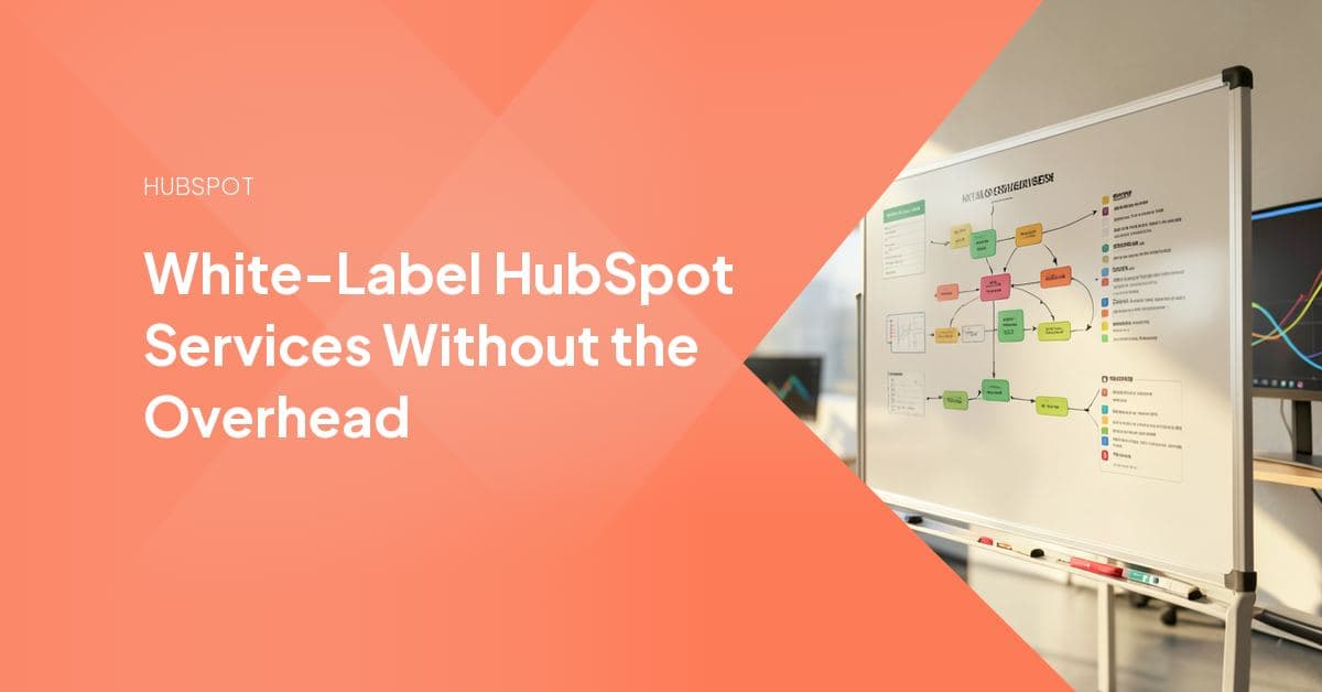Two professionals reviewing a HubSpot portal dashboard together, representing an agency and its white-label delivery partner working behind the scenes.